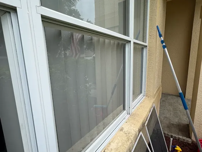 Screens removed and set aside during a Pelican Exteriors window cleaning