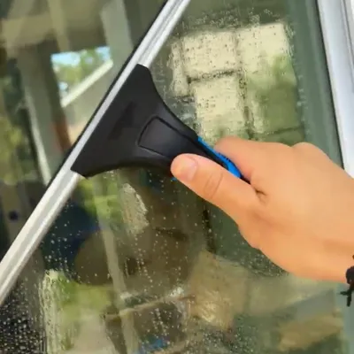 Squeegee finishing a clean window
